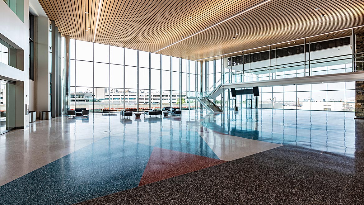 Glass curtain wall assemblies enhance building aesthetics and performance by supporting daylighting goals. 